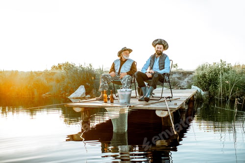 Preview: Grandfather with adult son fishing on the lake