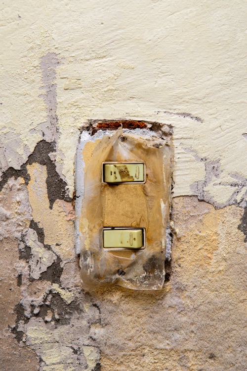 Preview: Close Up Dirty and Damaged Light Switch on Textured Old Wall