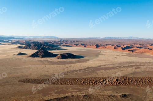 Preview: A serene desert landscape under a clear blue sky.