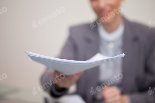 Preview: Paperwork Being Handed Over By Young Businesswoman