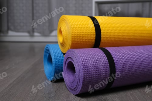 Preview: Rolled Exercise Mats in Yellow, Purple, and Blue