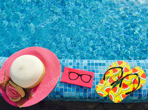 Preview: Flip flops with watermelons,pink sunglasses case and pink summer hat near the pool