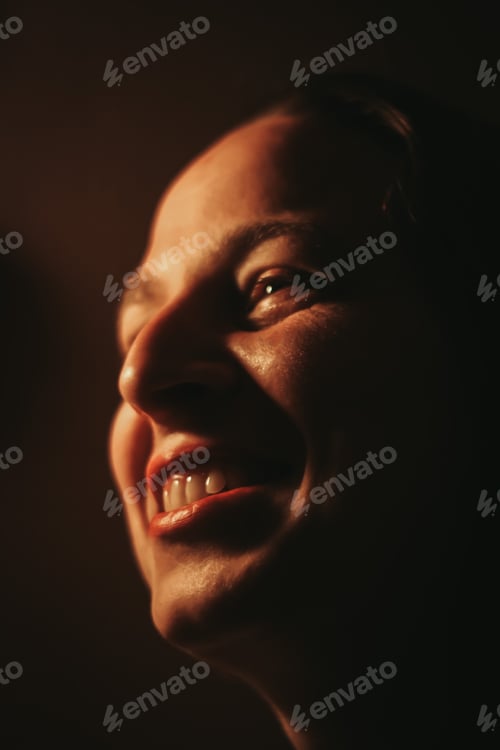 Preview: Close Up of a Woman Smiling in the Dark
