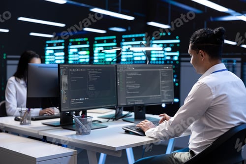 Preview: Employees in data center workspace running system diagnostic tests