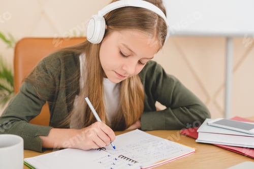 Preview: Pupil doing homework, e-learning, preparing for test writing remotely at home. Homeschooling concept