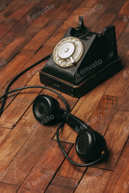 Preview: retro telephone black on a wooden floor classic to technology