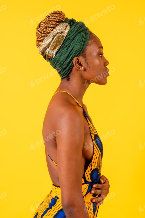 Preview: A person woman of black ethnicity with traditional costume on yellow background, profile model