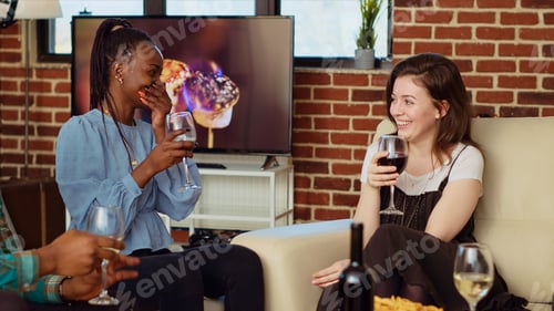 Preview: BFFs talking on couch, consuming drinks at social reunion and catching up with each other