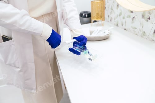 Preview: Unrecognizable Medical Professional Preparing Aesthetic Injection