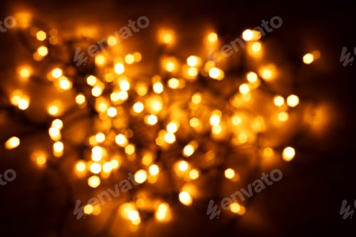 Preview: Garland glowing with warm light in dark.