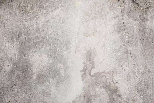 Preview: Concrete surface showcasing texture and wear with subtle variations in color under indoor lighting
