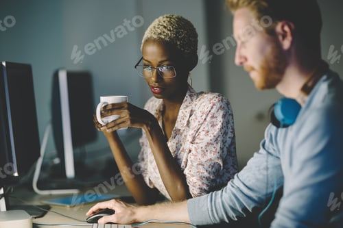 Preview: Colleagues working together in company office