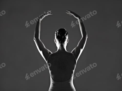 Preview: She lives to dance. Silhouette of a young ballerina dancing against a dark background.