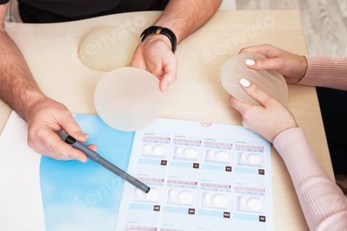 Preview: A plastic surgeon doctor shows a sample set of a silicone implants for breast augmentation