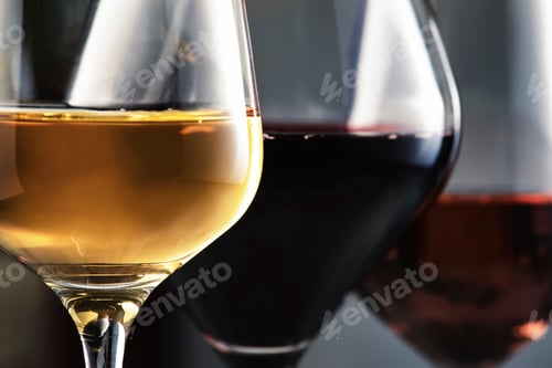 Preview: Wines assortment. Red, white, rose wine in wineglasses and bottles on gray background. Wine bar