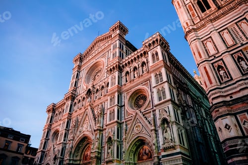 Preview: low angle view of Duomo Cathedral with Giotto Bell Tower Facade in Florence, Italy