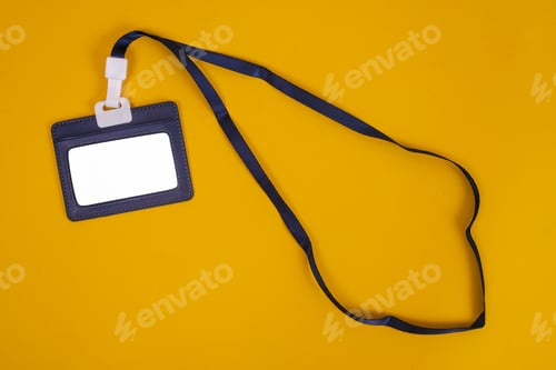 Preview: Flat Lay Of Blank Black ID Card Badge Holder With Lanyard Isolated On Yellow Background