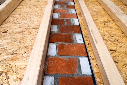 Preview: Construction of wood frame walls of a new country house site. Unfinished construction work inside.