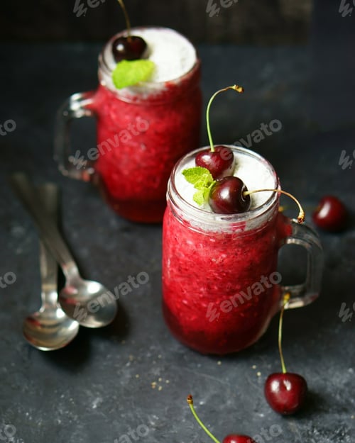 Refreshing Cherry Drink Topped with Cream and Mint