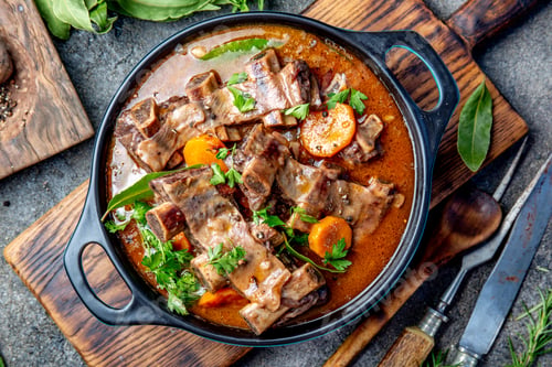 Preview: Beef ribs Bourguignon. Beef ribs stewed with carrot, onion in red wine. France dish. Top view