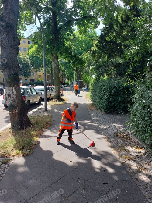 Preview: Pre-school boy volunteer sweeps the street