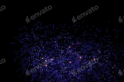 Preview: Night-time scene featuring a stunning display of colorful fireworks lighting up the sky