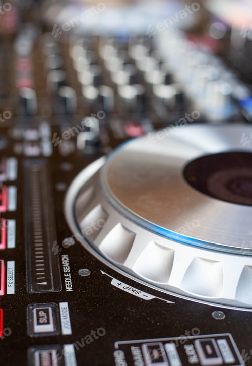 Preview: Disc Jockey DJ mixing deck and turntables with controls for mixing music for a party or disco
