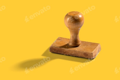 Preview: Wooden vintage hand stamp on yellow background