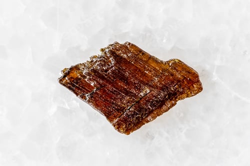 Preview: sample of rough rutile mineral on white marble