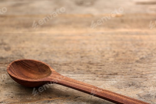 Preview: Clean spoon and space for text on wooden background