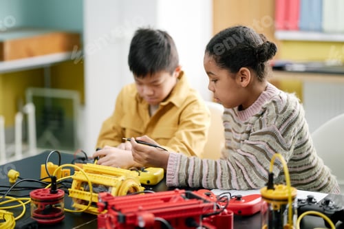 Preview: Two Children Engaging with Educational Robotics in Classroom