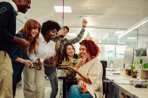Preview: Diverse business people celebrating their female hispanic colleague birthday