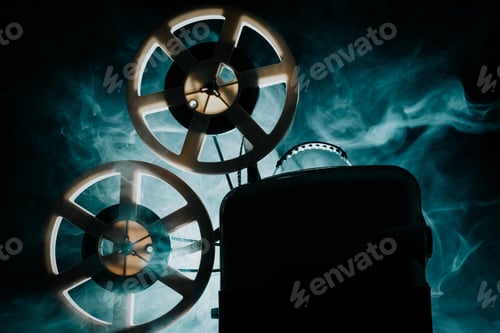 Preview: Retro projector playing motion picture. dark room. Timeless flicker of old films
