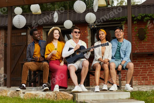 Preview: Friends Playing Guitar Outdoors in Summer