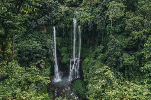 Preview: scenic landscape with green trees and majestic waterfall Sekumpul, Bali