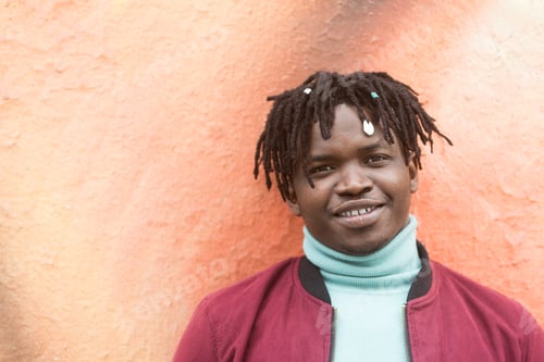 Preview: Black man smiling at camera. Close up.