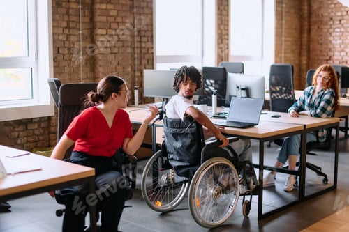 Preview: A diverse group of business professionals collaborates in a modern startup coworking center