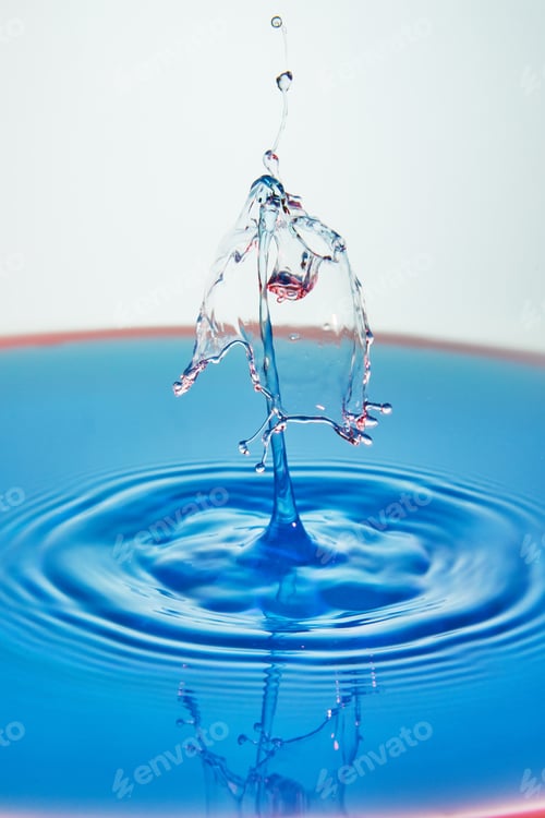 Preview: Abstract background of splash of color water, collision of colored drops