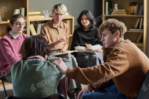Preview: Diverse Teenagers Offering Support and Listening during Group Therapy Session