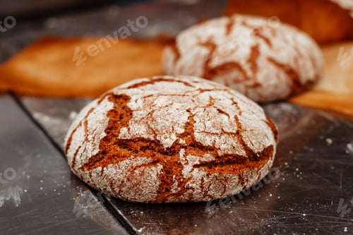 Preview: freshly baked bread on the table in the bakery