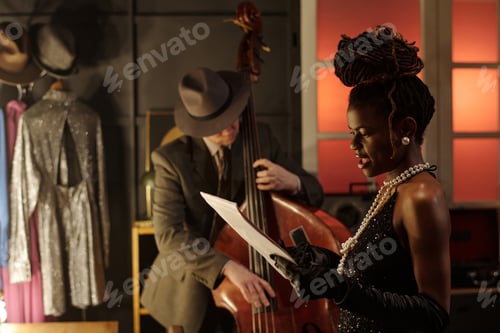 Preview: Young Black Woman Singing While Middle Aged Caucasian Man Playing Double Bass