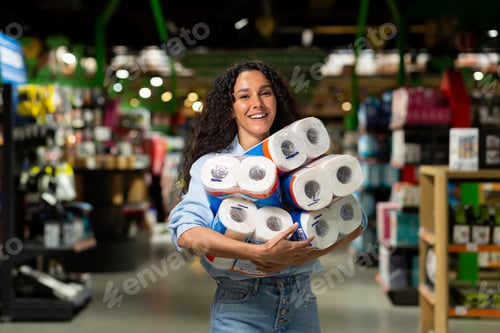 Preview: Happy woman shopper smiling bought many rolls of toilet paper in supermarket