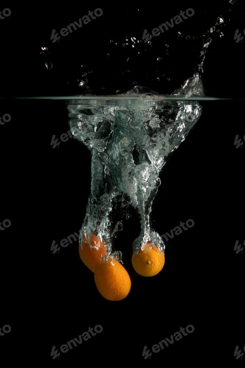 Preview: Three kumquat falls under water with splash
