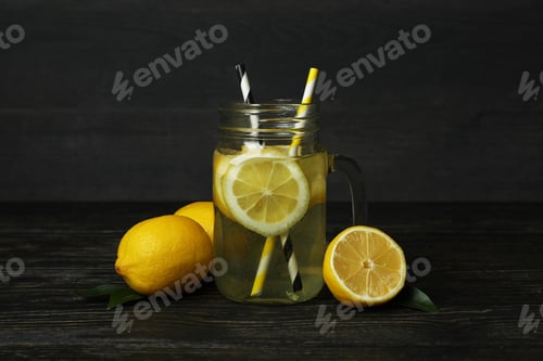 Preview: Jar of lemonade on wooden background, close up