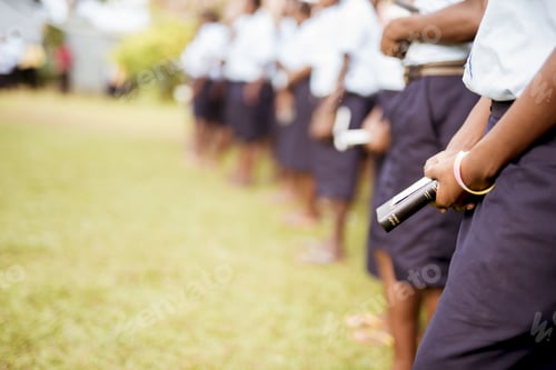 Preview: Shallow focus shot of a person wearing a uniform and holding the bible