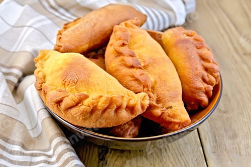Preview: Patties fried in bowl with napkin on board