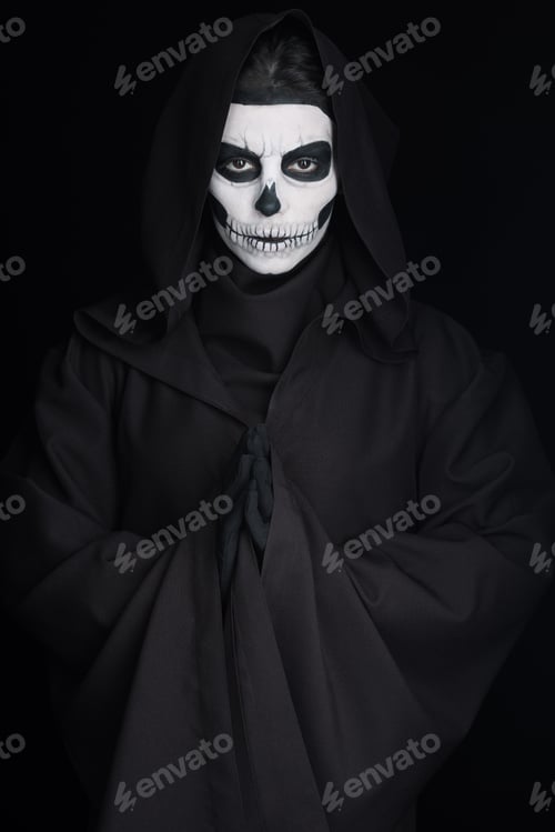 Preview: woman with skull makeup showing please gesture isolated on black