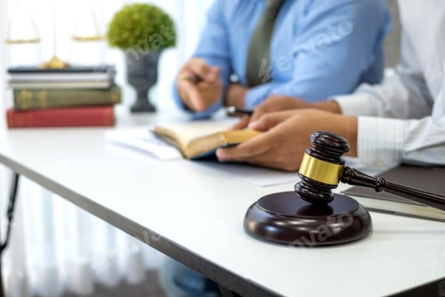 Preview: Business lawyer working about legal legislation in courtroom to help their customer.