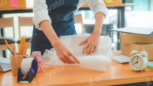 Preview: Online small business owners are packing their ordered products into the boxes