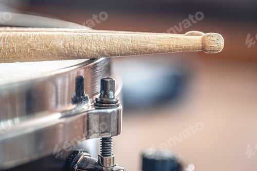 Preview: Close-up, drumsticks on a blurred background.